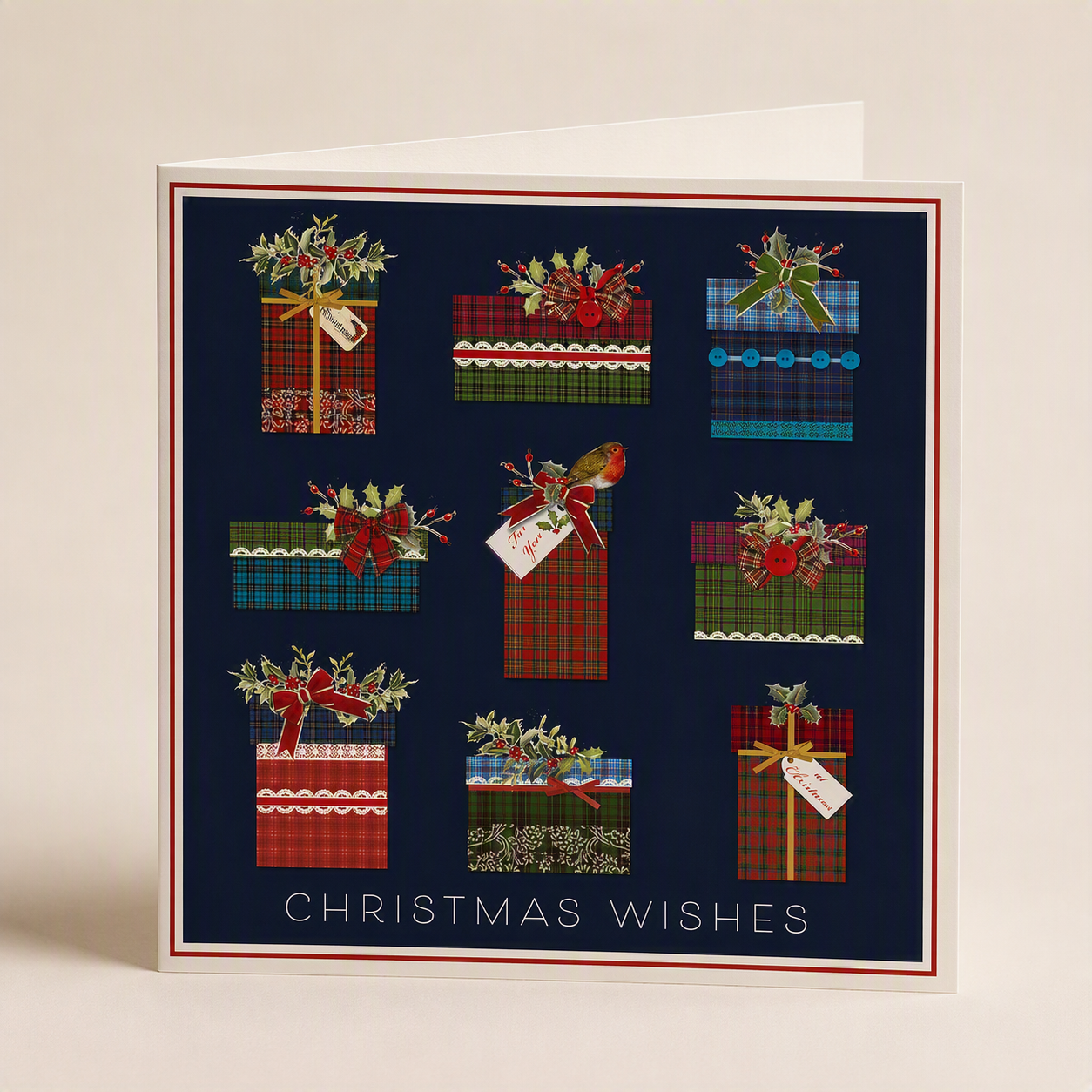 Square Christmas card with tartan gift illustrations, holly accents, and the text Christmas Wishes on a dark blue background.