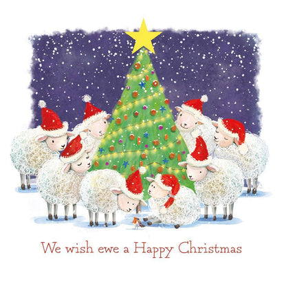 Flock of sheep in Santa hats gathered around a decorated Christmas tree on a square satin-finish charity card.