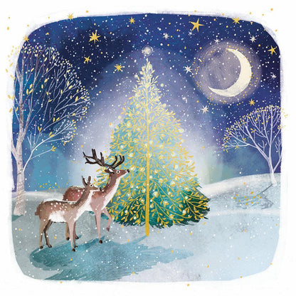 Two deer stand by a glowing gold foil Christmas tree under a starry moonlit sky on this eco-friendly square greeting card.