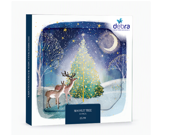 Box of 10 Moonlit Tree Christmas cards featuring deer in a snowy landscape with gold foil accents on a blue night sky.