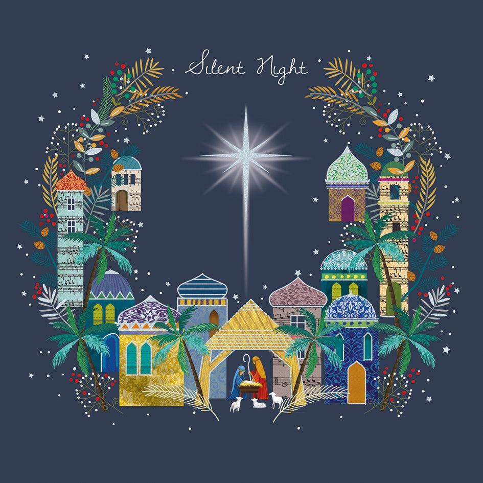 Bethlehem nativity scene with silver foil star, colorful patterned buildings, and palm trees on a dark blue background.